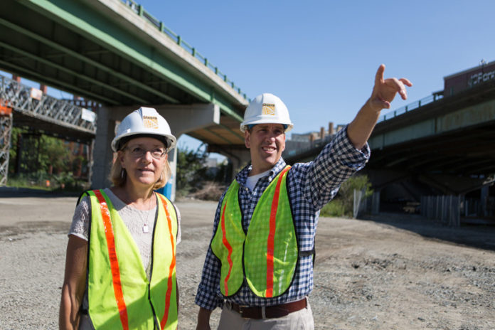 FINDING A FASTER WAY: When Patricia Steere founded her company, she found a niche in replacing bridges more quickly than it had been done traditionally. Here she confers with Chief Engineer Martin Pierce on the site of the Providence Viaduct replacement. / PBN PHOTO/RUPERT WHITELEY