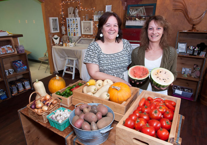 BUY LOCAL: New England Farm and Artists opened in 2013 as a way to “help support and build” community. Pictured above are Laurie Tapozada, left, owner of New England Farm and Artist in West Greenwich, and Renee LaPorte, of Delectible Edibles, with whom Tapozada shares the space. / PBN PHOTO/MICHAEL SALERNO