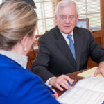 A USEFUL TOOL: The reverse mortgage can make a real difference in the quality of life for an elderly person, says attorney Kevin Hackman, speaking with associate Elizabeth Phillips at Elder Law RI LLC, but it must be understood so that there are no surprises. / PBN PHOTO/ MICHAEL SALERNO