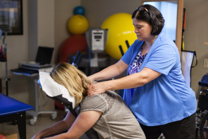 PBN PHOTO/RUPERT WHITELEY
TAKING CARE OF THEIR OWN: West View Nursing and Rehabilitation Center provides a suite of wellness benefits, among them massage therapy for stress reduction, provided in the picture above by Carole Hesford to staffer Kim Anderson.
