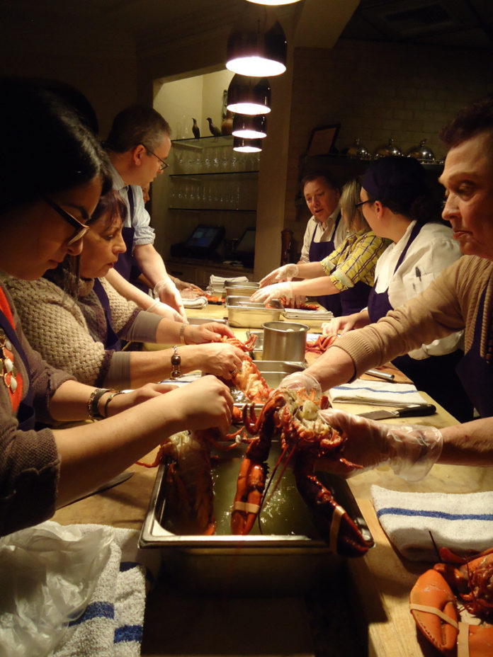 SPICE OF LIFE: Cooking class members prepare local lobster at the Spiced Pear at Chanler in Newport. / COURTESY SPICED PEAR AT THE CHANLER