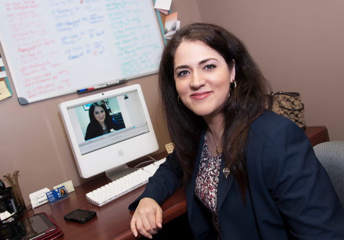 BEYOND LAWN SIGNS: Real estate agents have turned to SEO techniques to boost their image online. Julie Boyle, pictured above, of Re/Max Central in Coventry uses a video blog to boost her online visibility. / PBN PHOTO/ MICHAEL SALERNO