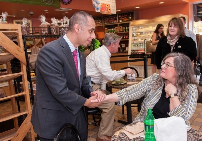 MEET AND GREET: Mayor-elect Jorge Elorza shakes hands with Zita Bolton at LaSalle Bakery the day after winning his race against Vincent A. 