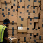 CYBER MONDAY SALES growth is slowing, according to International Business Machines Corp. In this file photo from December 2013, an employee loads a truck at the Amazon.com Inc. fulfillment center in Phoenix, Ariz. / BLOOMBERG FILE PHOTO/DAVID PAUL MORRIS
