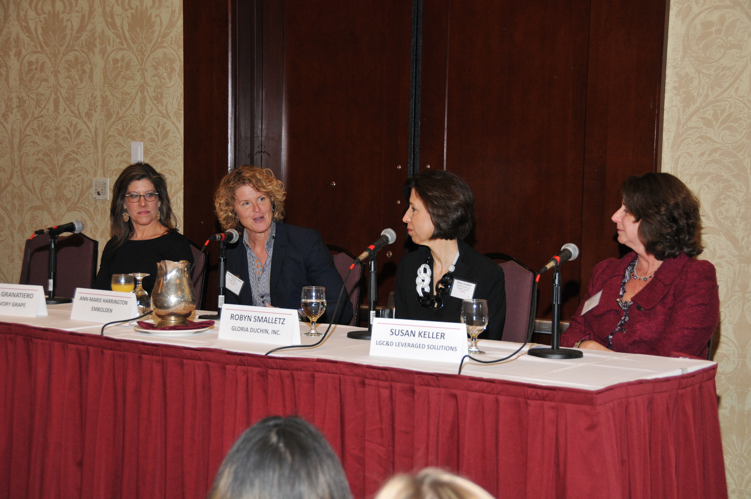 WITH MORE THAN 200 in attendance at the Crowne Plaza Providence-Warwick, the two panels at PBN's inaugural Business Women Summit on Leadership & Entrepreneurship took on issues that included achieving success in a corporate environment as well as how to succeed at starting your own business. Ann-Marie Harrington, founder and CEO of Embolden, second from left, speaks to the second topic on a panel that includes, from left, Jessica Granatiero, owner and president of The Savory Grape and The Savory Affair, Robyn Smalletz, president and CEO of Gloria Duchin, and Susan Keller, managing director of LeveragedSolutions, a division of LGC&D. / PBN PHOTO/MIKE SKORSKI