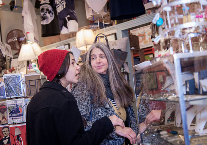 THINKING SMALL: Liv Jasmine, left, and her mother, Josephine Curry of Cranston, shop at Frog & Toad on Hope Street in Providence on Small Business Saturday in 2016. / PBN FILE PHOTO/MICHAEL SALERNO