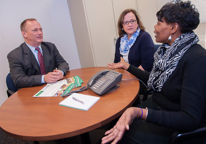 SETTING A PLAN: From left: Neighborhood Health Plan of Rhode Island CEO Peter M. Marino, Vice President Brenda Seagrave-Whittle and member advocate Jacqueline L. Dowdy. / PBN PHOTO/MICHAEL SALERNO