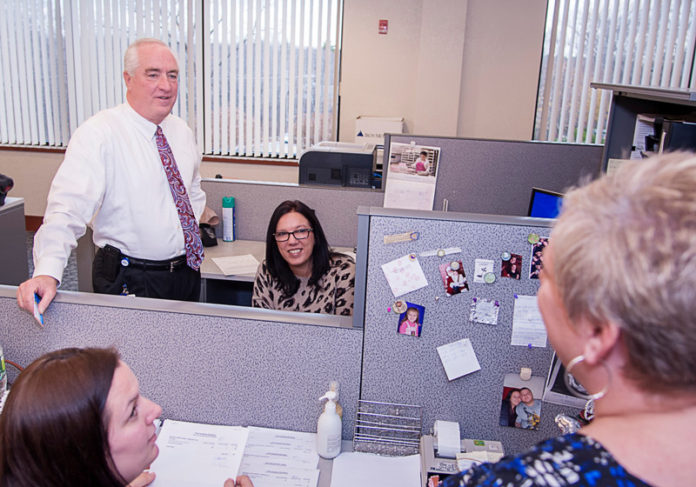 SECURITY BLANKET: Navigant Credit Union Chief Security Officer Steve Ormerod speaks with, from left: Emily Stewart, Renee Remillard and Donna Truppi. / PBN PHOTO/MICHAEL SALERNO