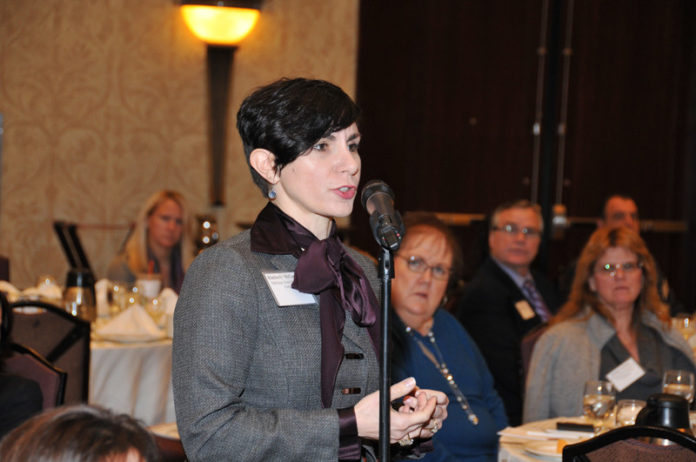 CROSS EXAMINATION: Kimberly McCarthy, a partner at Partridge Snow & Hahn, asks a question at the Providence Business News summit on Leadership and Entrepreneurship. / PBN PHOTO/MICHAEL SKORSKI