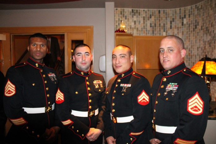 FROM LEFT: U.S. Marine Staff Sgt. Deries Kaywood, U.S. Marine Sgt. Matthew Roby, U.S. Marine Cpl. Brandt Weilbacher and U.S. Marine Staff Sgt. William Fitzpatrick were on hand at Homestar Mortgage’s annual holiday event to collect toy donations for families in need this holiday season.