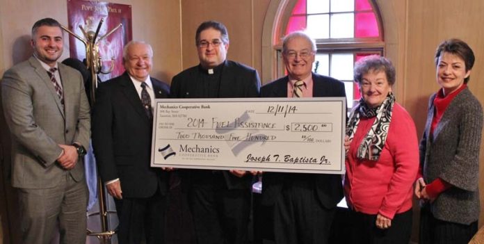 FROM LEFT: Sean Bettencourt, Mechanics Cooperative Bank branch manager; Frank Souza, Society of St. Vincent de Paul co-president; Father Costa, Annunciation of the Lord Parish; Paul Botelho, Society of St. Vincent de Paul vice president; Jeanne Souza, Society of St. Vincent de Paul co-president; and Olga Andrade, Mechanics Cooperative Bank mortgage lender, pose after Mechanics donates $2,500 to the Society of St. Vincent de Paul’s fuel-assistance program.