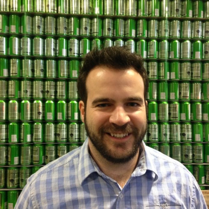 BEER MARKET: Nick Garrison, founder of Pawtucket-based Foolproof Brewing, traded a career at Raytheon for his passion project after visiting a brew pub in Quebec. / COURTESY FOOLPROOF BREWING