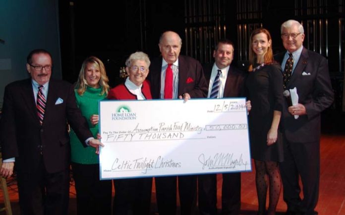 FROM LEFT: Laurence K. Flynn, chairman, Omni Development Corp.; Tomma Botelho, coordinator, Home Loan Investment Bank; Sister Angela Daniels; John M. Murphy Sr., founder and chairman, Home Loan Investment Bank; Scott A. Slater; Kate Barba Murphy, Regan Communications, and Judge Francis J. Darigan pose after the Assumption Parish Food Ministry was presented a $50,000 check.