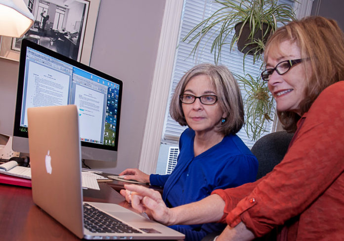 FLEX TIME: Helen Mederer, left, URI professor of sociology and labor research, and Barbara Silver, URI social psychology professor and research coordinator at the Schmidt Labor Research Center. Silver is studying the importance of workplace flexibility to a robust state economy. / PBN PHOTO/MICHAEL SALERNO