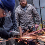 Raimondo: New plan for old problems needed GRINDING IT OUT: Jeff Rosenzweig, right, the program manager for SLIDE, instructs Guillermo Diaz, a sophomore at the Met school, as he constructs a skateboard rail. / PBN PHOTO/MICHAEL SALERNO