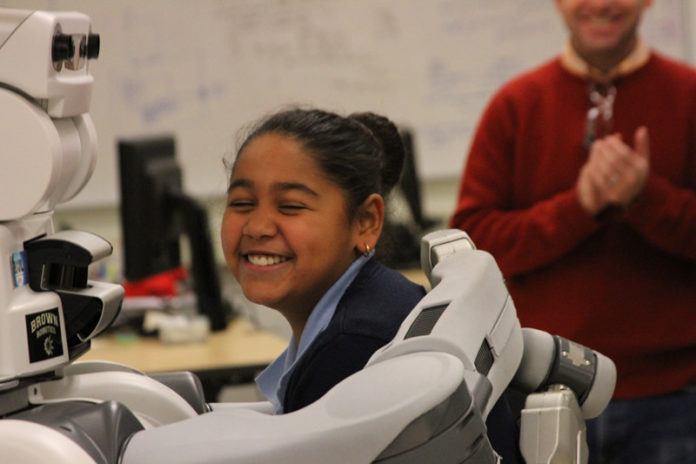 ROBOTS ROCK: Sixty sixth grade students from The Learning Community, including Zamira Jazmin-Costa, pictured above, recently visited the Robotics Lab at Brown University. / COURTESY BROWN UNIVERSITY