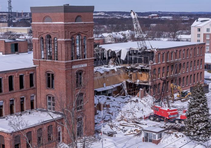 AFTER FINDING IT NOT FEASIBLE to redevelop the Elizabeth Mill in Warwick near T.F. Green Airport, Michael Integlia & Company began demolition of the 19th-century structure to make room for a 300,000-square-foot mixed-use building. / PBN PHOTO/ MICHAEL SALERNO AFTER FINDING IT NOT FEASIBLE to redevelop the Elizabeth Mill in Warwick near T.F. Green Airport, Michael Integlia & Company began demolition of the 19th-century structure to make room for a 300,000-square-foot mixed-use building. / PBN PHOTO/ MICHAEL SALERNO