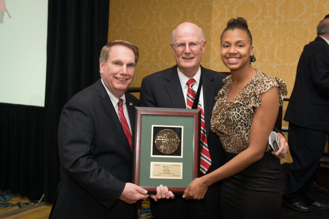 JA&rsquo;s Education Committee Chairman, Steve Kitchin of New England Tech, presents BankRI Chairman John Yena with his 2014 award. With Dr. Yena is Jeira Titon, a student from The Met Center for Innovation and Entrepreneurship.
