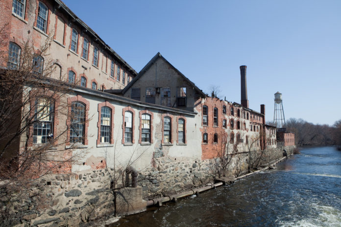 DEVELOPER Larry Silverstein's plan to redevelop Pontiac Mills in Warwick includes creating a riverwalk along the Pawtuxet River the runs alongside the old textile mill. / PBN FILE PHOTO/RUPERT WHITELEY