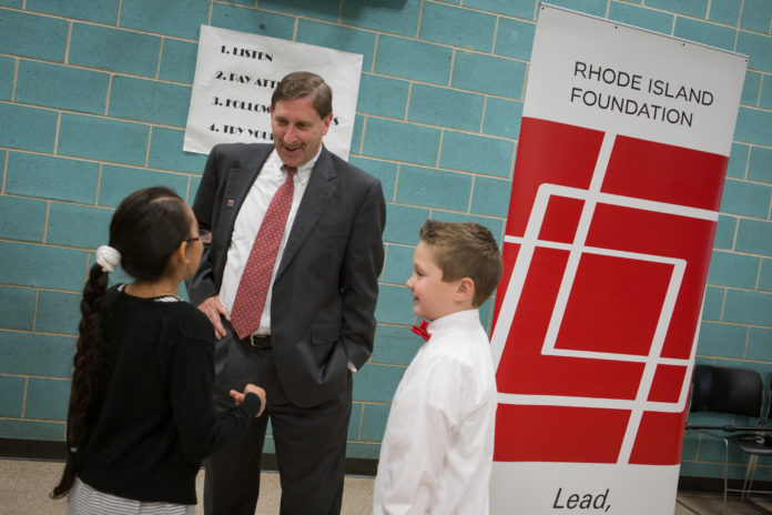 RHODE ISLAND Foundation President and CEO Neil Steinberg visits with two Pawtucket third-graders after announcing nearly $160,000 in grants for classroom innovation. The Spark Grants were just one more than 1,000 awards the foundation made last year. / COURTESY RHODE ISLAND FOUNDATION