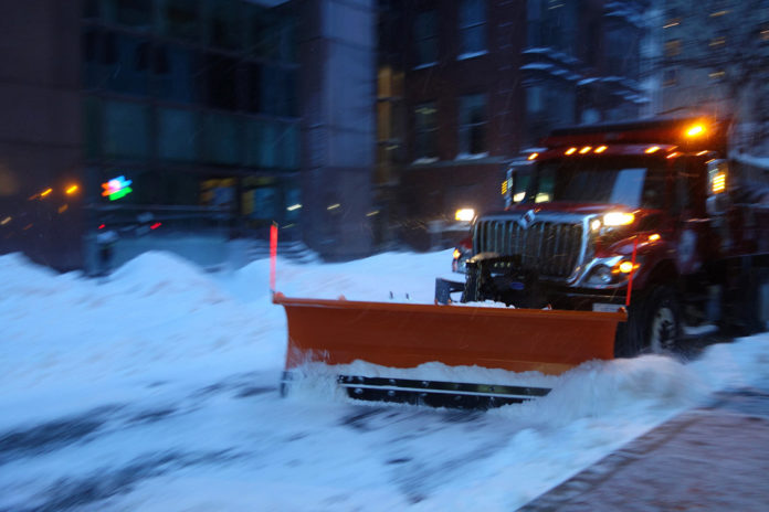 A SNOW PLOW seen in downtown Providence during a recent snow storm. February was the snowiest February on record for the city, according to the National Weather Service.  / PBN FILE PHOTO/FRANK MULLIN
