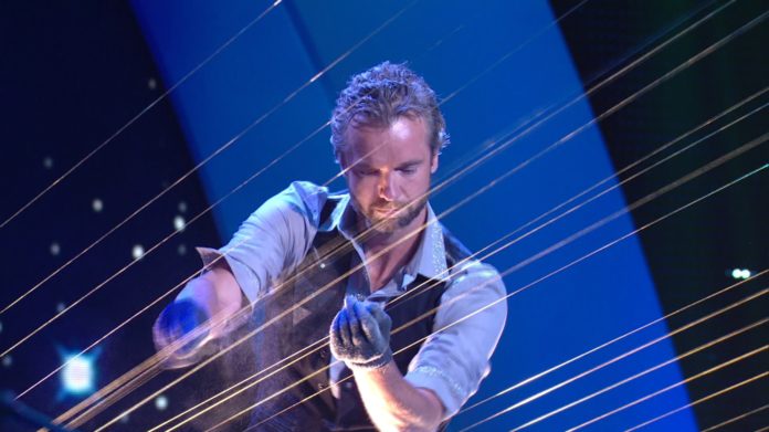 EARTH HARP founder William Close is shown playing the instrument - billed as the world's largest stringed instrument. Close will play the Earth Harp at the International Arts Festival in June in downtown Providence.