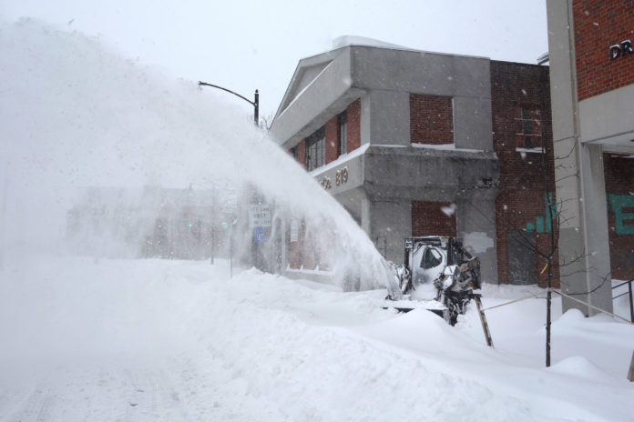 HEAVY SNOW and blizzard conditions as seen in Providence on Jan. 27 during the storm known as Juno. The R.I. Emergency Management Agency will conduct briefings this week for applicants interested in reimbursement from the storm. / PBN FILE PHOTO/FRANK MULLIN