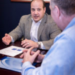 Some jobs restructured due to health costs CHANGING ENVIRONMENT: Robert F. Calise, principal with Cornerstone Group, speaks with senior benefits consultant Jim Borah, right. Calise says deciding how to structure positions while covering health care costs and avoiding penalties for noncompliance is a new challenge for companies. / PBN PHOTO/MICHAEL SALERNO