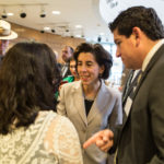 GOV. GINA M. RAIMONDO speaks with Maria Kasparian, executive director of Manufacturing Award-winning Edesia, before the program began Thursday at Bryant University. / PBN PHOTO/RUPERT WHITELEY