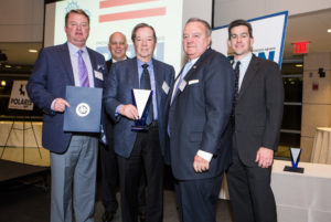 Craig Melucci, Richard Bready and Thomas Melucci of Hope Valley Industries accept the award for Excellence at a Large Manufacturer / Rupert Whiteley