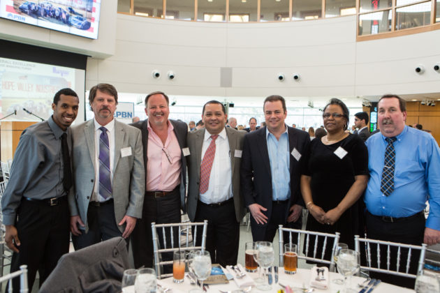 Employees from Quick Fitting celebrate with President David Crompton (third from left) / Rupert Whiteley