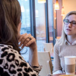 TAKING THE LEAD: Rebecca Bertrand, right, interim deputy director at Newport Art Museum, and Lori Urso, executive director of the Old Slater Mill Association, discuss leadership strategies. / PBN PHOTO/ MICHAEL SALERNO