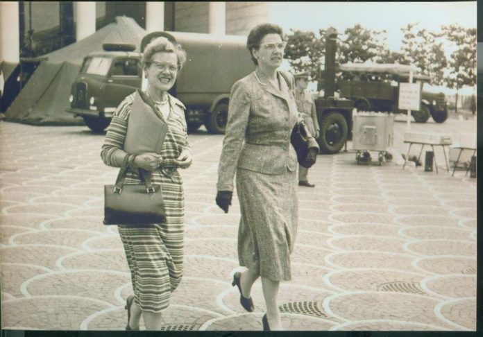 JANE C. EBBS, right, is seen walking in this photo from 1960 with an unidentified woman. Ebbs, a Newport native who died in December, has left $1 million in bequests collectively to the Redwood Library and Athenaeum and the University of Rhode Island. / COURTESY OFFICE OF THE QUARTERMASTER GENERAL