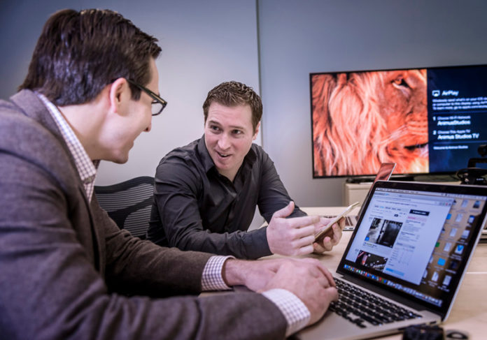 THINKING AHEAD: Founded in 2011, Animus Studios works with marketing agencies and with individual companies on video strategy or videos. Above, Animus Studios partners Justin Andrews, left, and Scott Beer discuss strategies for upcoming projects. / PBN PHOTO/MICHAEL SALERNO