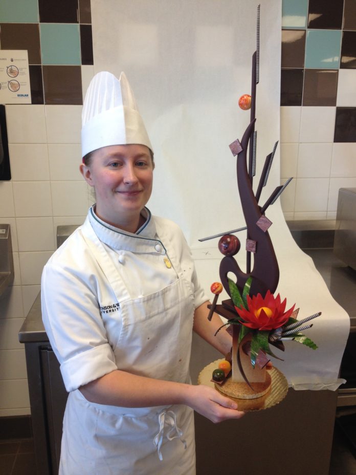 COURTNEY L. SEGAL, a senior at Johnson & Wales University, is holding a centerpiece made of chocolate. She is one of eight women who received 2015 Women in Culinary Leadership Grants from the James Beard Foundation. / COURTESY COURTNEY SEGAL
