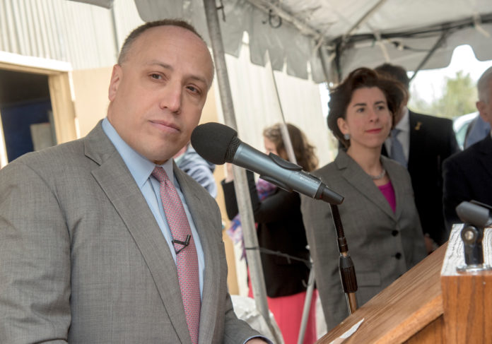 AT AN EVENT MONDAY IN THE QUONSET BUSINESS PARK, Deepwater Wind CEO Jeff Grybowski, left, and Gov. Gina M. Raimondo marked the beginning of construction activity for the five-turbine Block Island Wind Farm, which is expected to be operational by the end of 2016. / PBN PHOTO/MICHAEL SALERNO