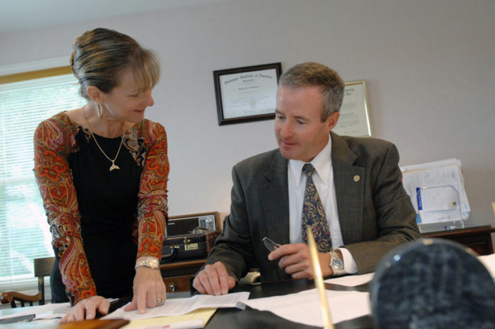 STEPHEN SCHONNING, president, and Bethany Schonning McGill, former vice president, are shown in this file photo from 2012 at Schonning Insurance Services in Westerly. The company has been acquired by Cross Insurance in Maine. / PBN FILE PHOTO/ BRIAN MCDONALD