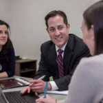 Saul a calming? force in the storm PLANNING AHEAD: Zachary J. Saul, director of finance, Employees Retirement System of Rhode Island, says that some of the state pension reforms implemented in 2011 have helped and will continue to do so. He's pictured here with Stacey Whitton, left, and senior accountant Erica Kwiatkowski. / PBN PHOTO/MICHAEL SALERNO