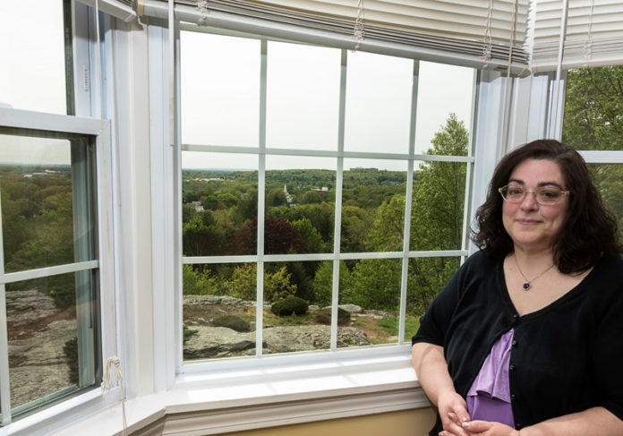 PLACE TO CALL HOME: Sherryl Amato, a condo owner in the Governor's Hill section of West Warwick, bought her home as a short-sale. She loves her condo, she says, because of the views and relatively affordable price. / PBN PHOTO/MICHAEL SALERNO