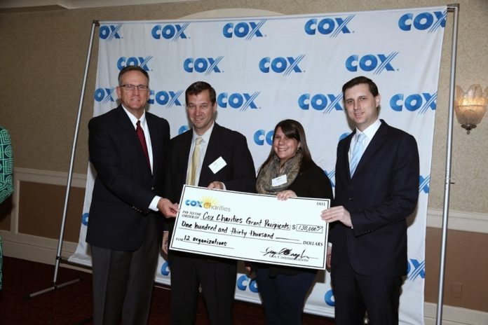 FROM LEFT: Jay Allbaugh, senior vice president and general manager, Cox Communications; Joseph Pratt, executive director/CEO, Boys & Girls Clubs of Newport County; Lauren Day, director of Camp Grosvenor and Youth, Boys & Girls Clubs of Newport County; and Rhode Island Treasurer Seth Magaziner, are seen at a recent event celebrating the awarding of approximately $130,000 in Cox Charities Community Grants to organizations with afterschool and summer programs focusing on STEM subjects. The Boys and Girls Clubs of Newport County received $11,192 to support its robotics program. / COURTESY COX COMMUNICATIONS