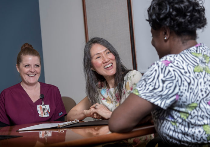 BLOOD AND SWEAT: Dr. Carolyn T. Young, center, says she loves the community aspect of Rhode Island. Also pictured is Jennifer Landry, left, senior donor-management specialist and Rachelle Laurent, donor specialist. / PBN PHOTO/MICHAEL SALERNO