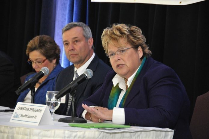 FORMER HEALTHSOURCE RI EXECUTIVE DIRECTOR CHRISTINE FERGUSON is seen in this file photo from 2013, Ferguson, on right, was at PBN's Summit on the Health Benefits Exchange. Ferguson was charged over the weekend by Jamestown police for furnishing alcohol to a minor. / PBN FILE PHOTO/MIKE SKORSKI