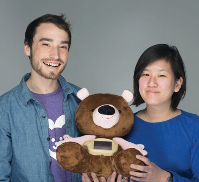 STARTUP SPROUTEL will receive nearly $150,000 in federal funding through the Small Business Innovation Research program. Pictured are Sroutel's Aaron Horowitz and Hanna Chung with their product, Jerry the Bear. / COURTESY SPROUTEL/IAN BARNARD