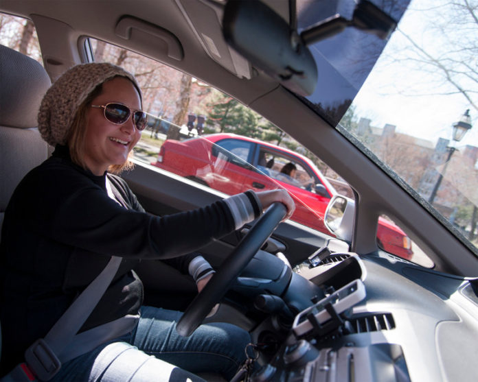 A LONG RIDE? Cecilia Navarro drives for ride-sharing app Lyft in a 2014 photo. / PBN FILE PHOTO/MICHAEL SALERNO