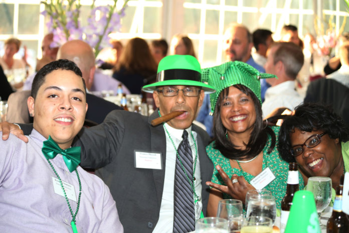 BANNEKER INDUSTRIES staff celebrate the company's Best Places To Work recognition Wednesday at the Crowne Plaza Garden Pavilion. The company placed 14th in the small company category in the 10th edition of the program. / PBN PHOTO/KAREN CASEY WARD