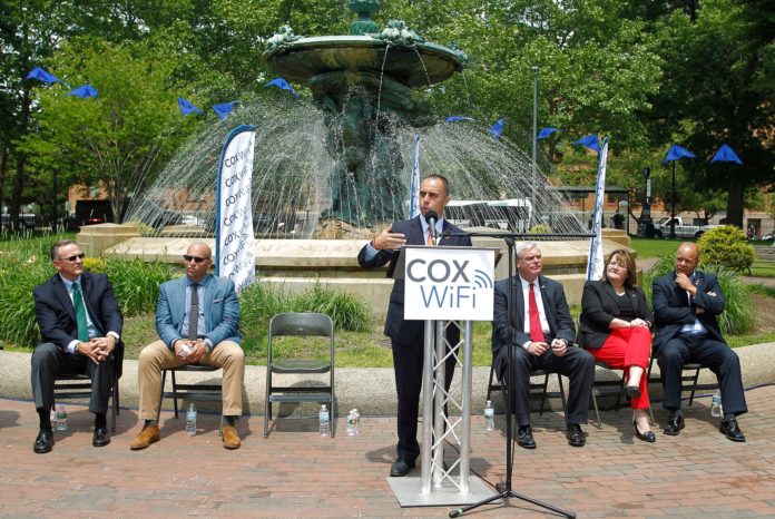 COX COMMUNICATIONS said that Kennedy Plaza in Providence has been wired with free high-speed Wi-Fi for Cox Communications customers. Providence Mayor Jorge O. Elorza is seen speaking at the event celebrating the launch on Thursday. Joining him, from left to right, are Jay Allbaugh, senior vice president and region manager, Cox Communications; Cliff Wood, executive director, Downtown Providence Parks Conservancy; Scott Avedisian, Warwick mayor and Rhode Island Public Transit Authority chairman; Jo-Ann Ryan, councilwoman, Providence; and state Sen. Juan PichardoThursday, June 11, 2015. (Stew Milne for Cox Communications) / COURTESY STEW MILNE/COX COMMUNICATIONS