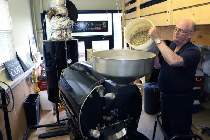 FRESH BREW: Before founding Custom Coffee House, Robert Mastin had a number of other jobs, including serving as a naval officer, author and contractor. Mastin learned to roast coffee at home, and in 2002 founded his company. / PBN PHOTO/KATE WHITNEY LUCEY