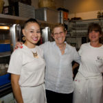 TIPPING POINT: Deb Norman, center, owner of Rue De L'Espoir, with employees Casandra Robinson, left, and Alycyn Bouckaert. Norman thinks the the tipped minimum wage should be raised by a dollar a year for at least three years. / PBN PHOTO/ JAIME LOWE