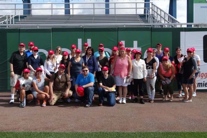 TAKE THEM OUT TO THE BALL GAME: Swarovski's 2014 summer staff outing was to a Pawtucket Red Sox game. / COURTESY SWAROVSKI