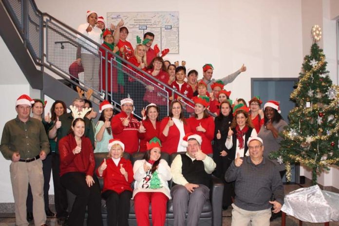 FEELING GOOD: Dominion Diagnostics has a number of recognition programs for employees. Here the office celebrates the 2014 holiday season. / COURTESY DOMINION DIAGNOSTICS